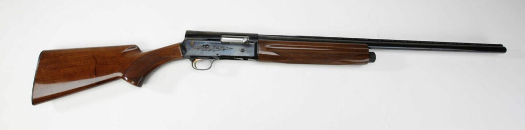 A Browning Auto 5 rifle on a white background.