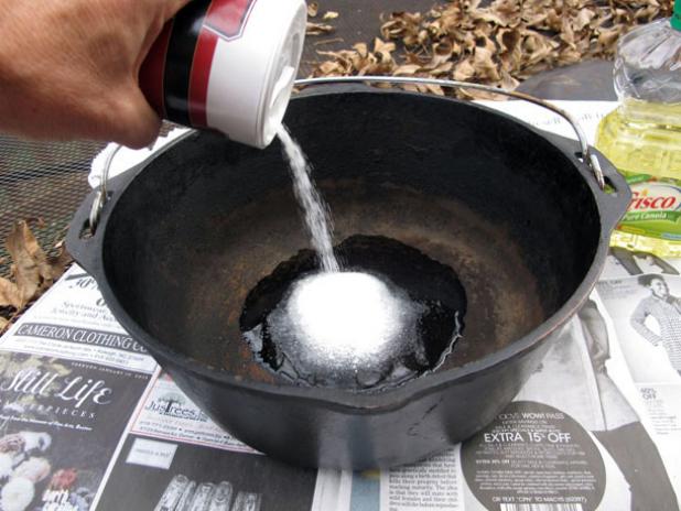 Combine oil and salt to remove a layer of build up and funk from your pot.