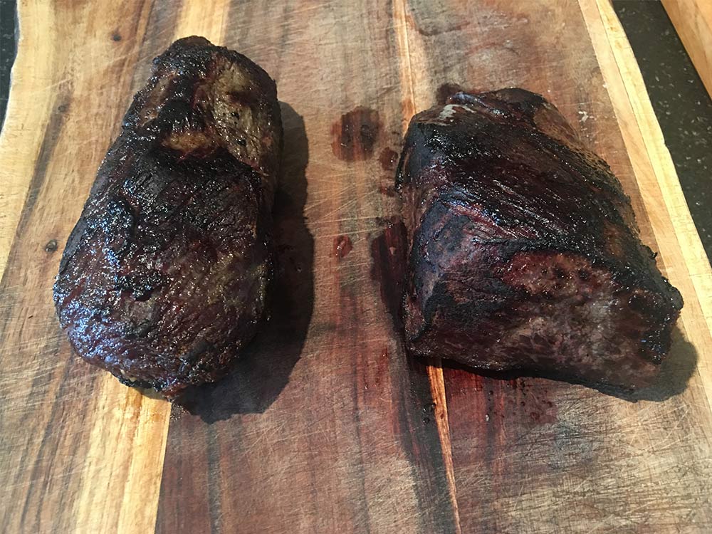 Cooked dry-aged wild game steaks come to a rest