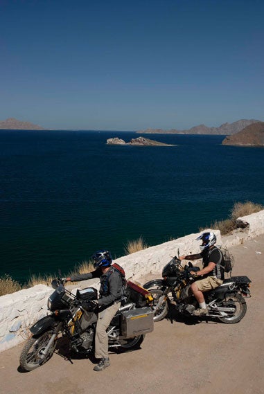 traveling baja california mexico by Kawasaki KLR650 dual-sport motorcycle to catch marlin roosterfish trout bonefish dorado shark jack and back to san diego up mexico highway one watching the baja 500