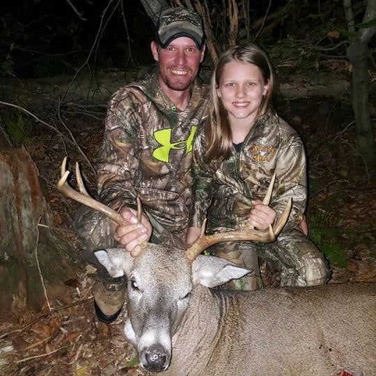 Young girl with an 8-point buck