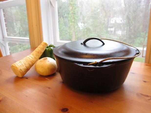 The fully restored cast iron dutch oven, ready to cook a meal.