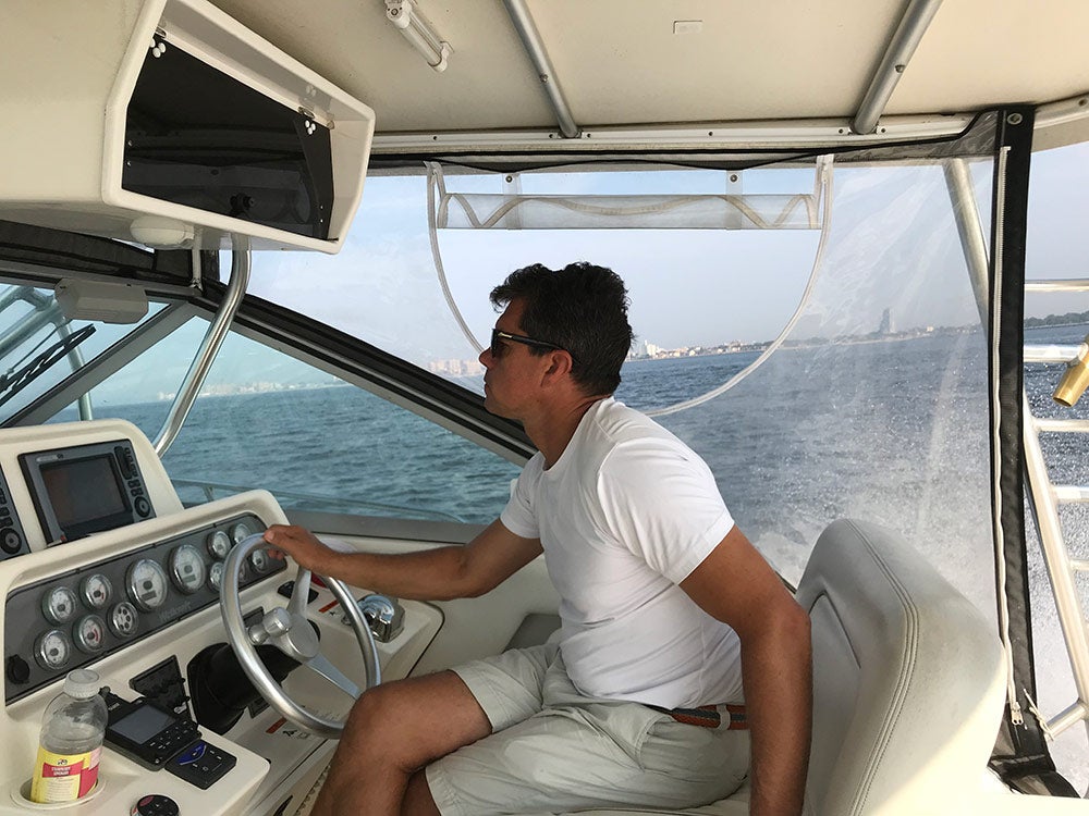 yuri krainov piloting fishing boat
