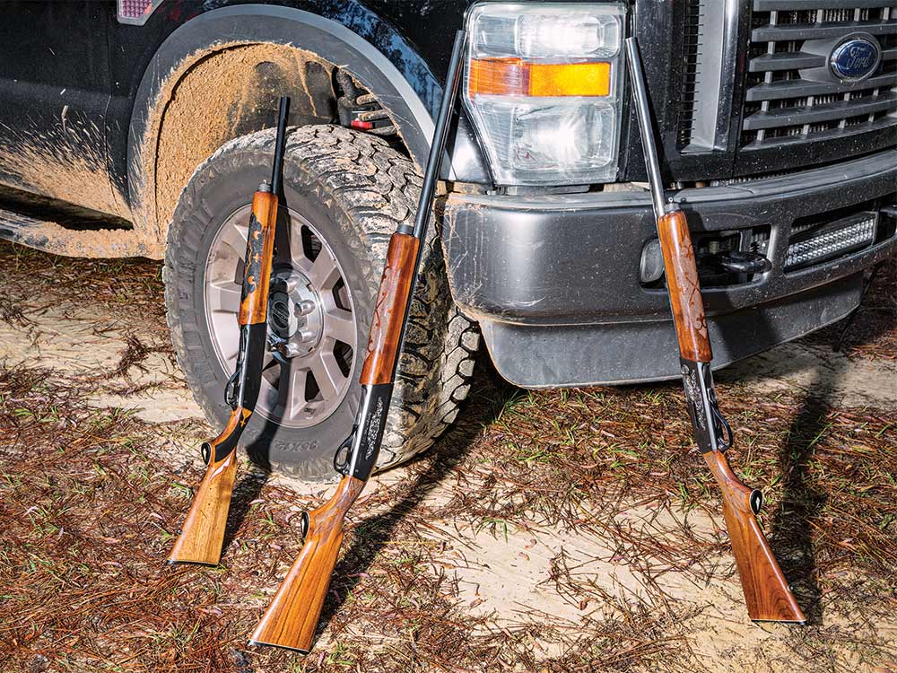 shotguns leaning against truck