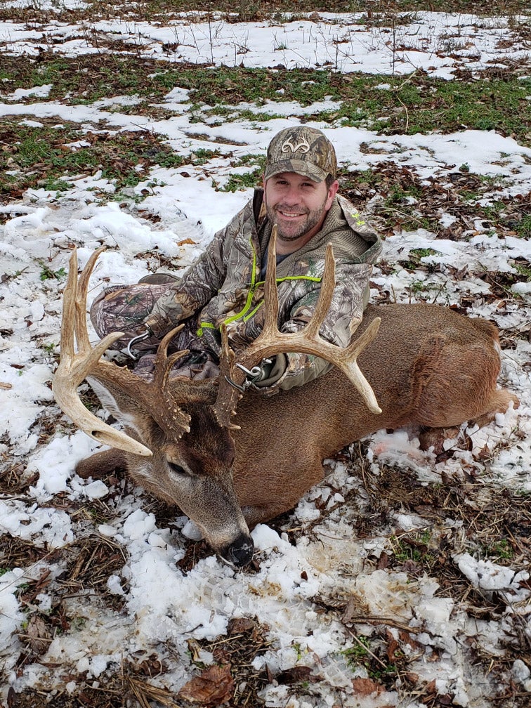 jason koger with 177 inch buck in the snow