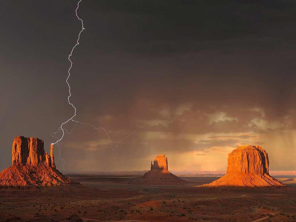 a lightning storm over an arizona mesa