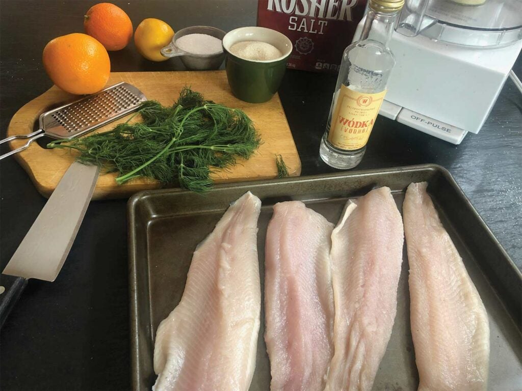 filleted rainbow trout with citrus and herb ingredients