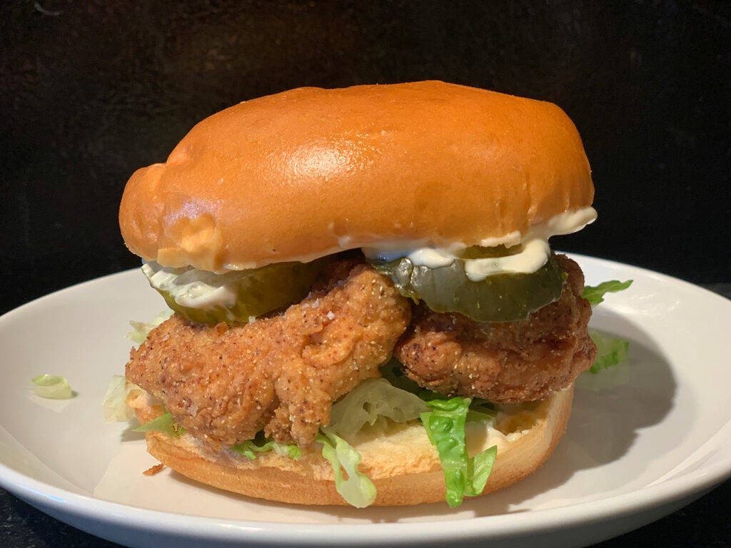 a sandwich made out of fried pheasant