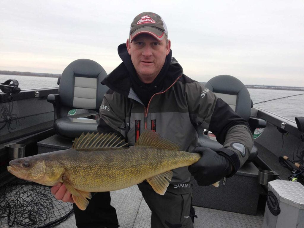 man holding a giant walleye