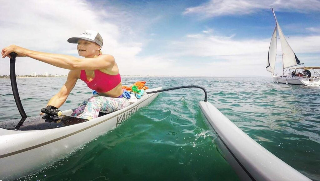 A paddler in the Outrigger Zone Kahele outrigger canoe.