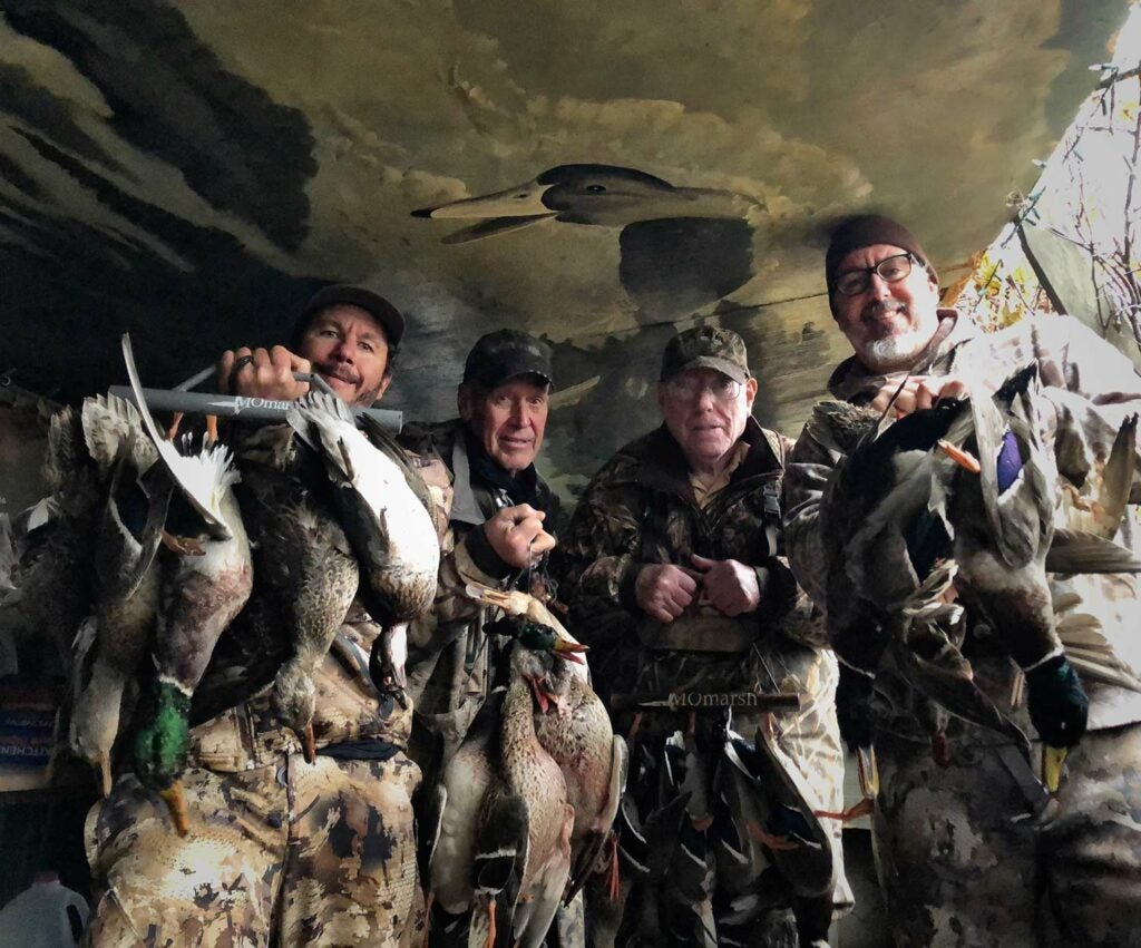 hunters gathered in a duck hunting blind