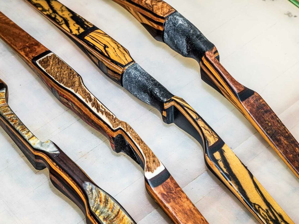 a lineup of traditional custom crafted bows