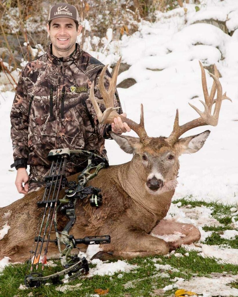 hunter with a whitetail deer