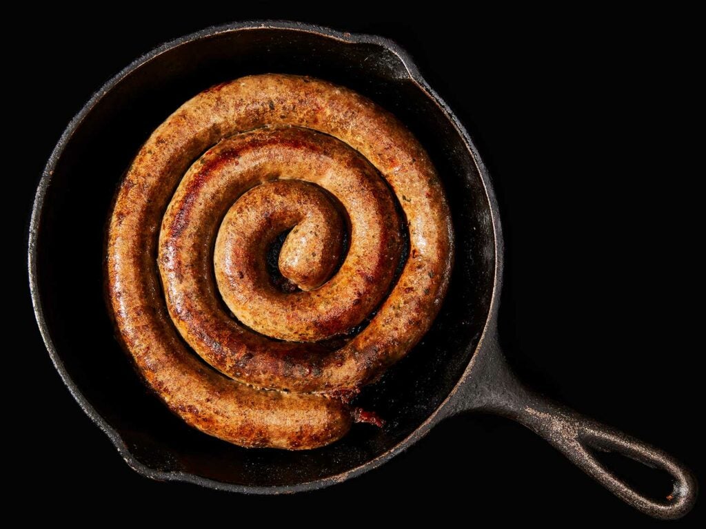 wild game sausage in a cast-iron skillet