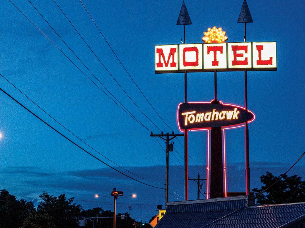 A motel sign at night.