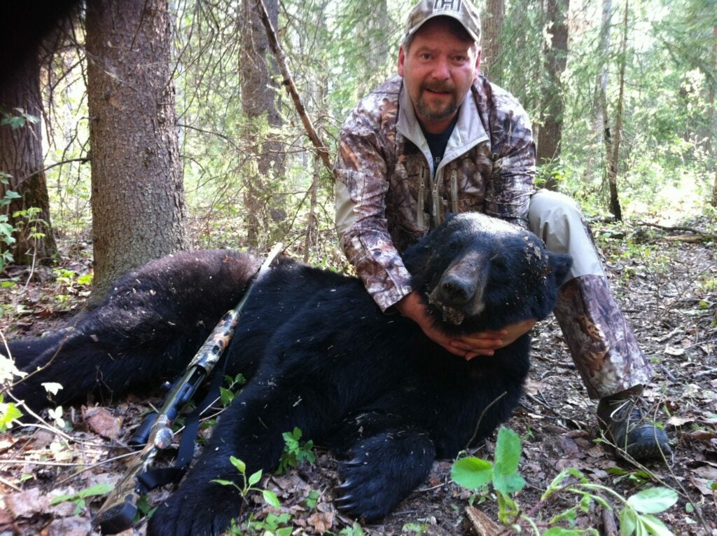 hunter with black bear.