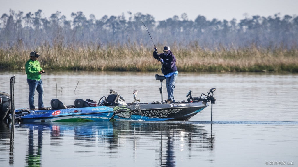 Larry Nixon swings another good bass into the boat.