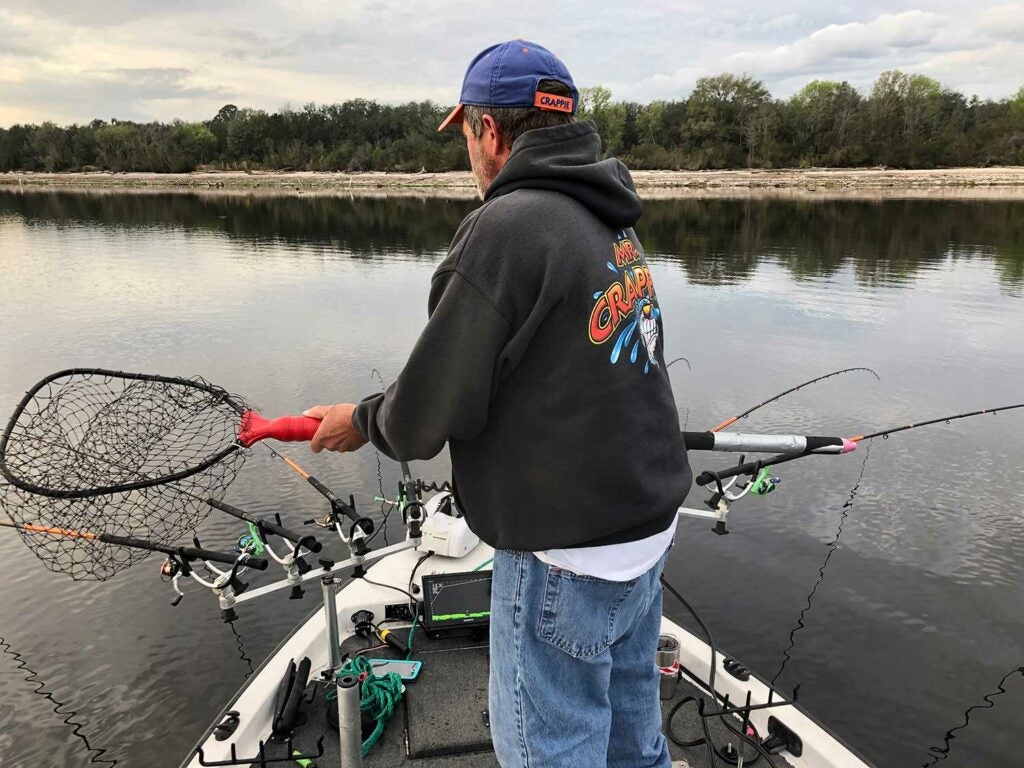 A long-handled, telescoping net helps land crappies with assurance.