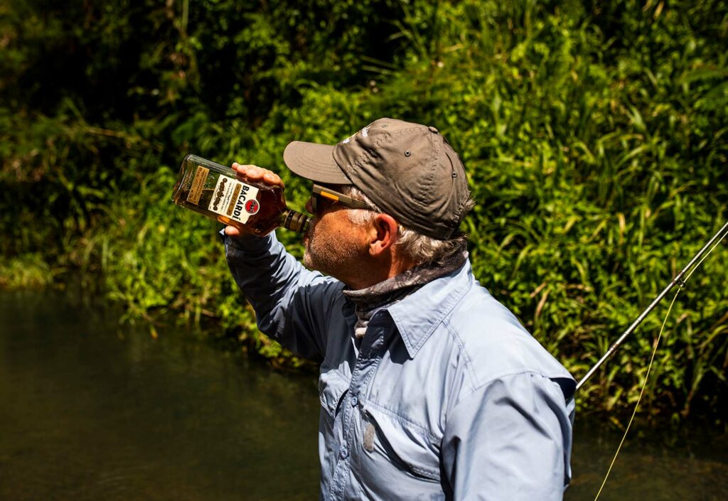 A fisherman sipping rum.