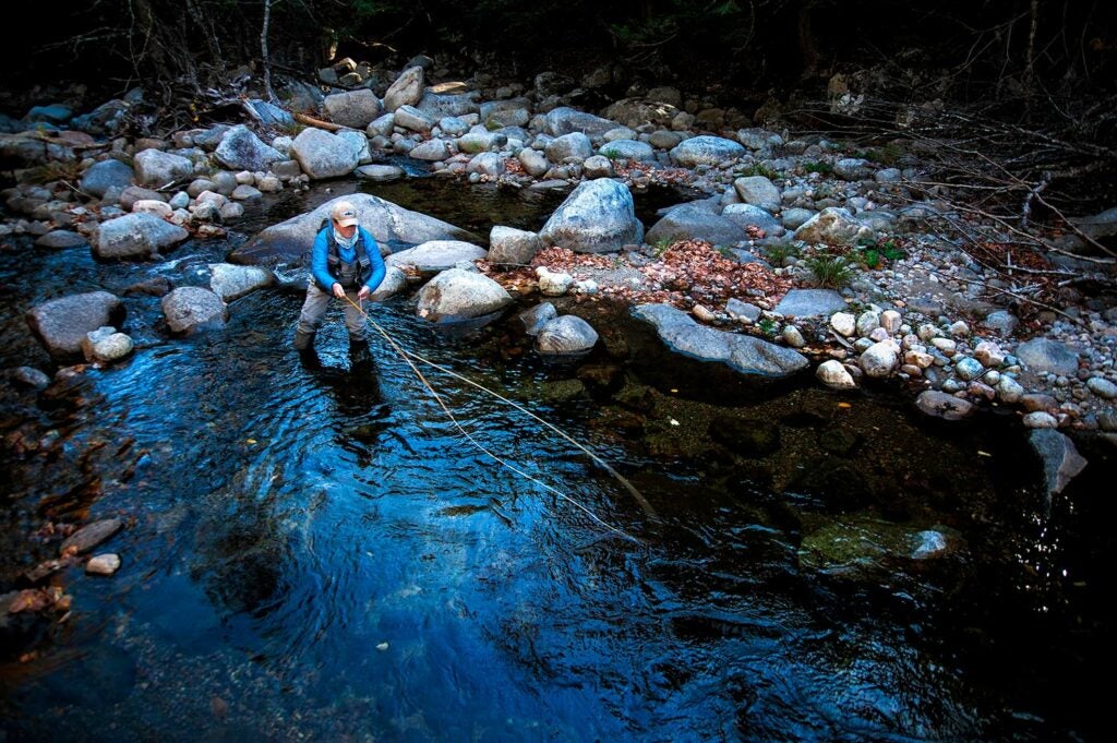 New York guide Rachel Finn in a rockbed creek.