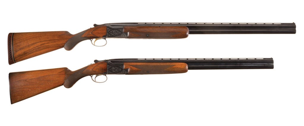 Two browning shotguns on a white background.