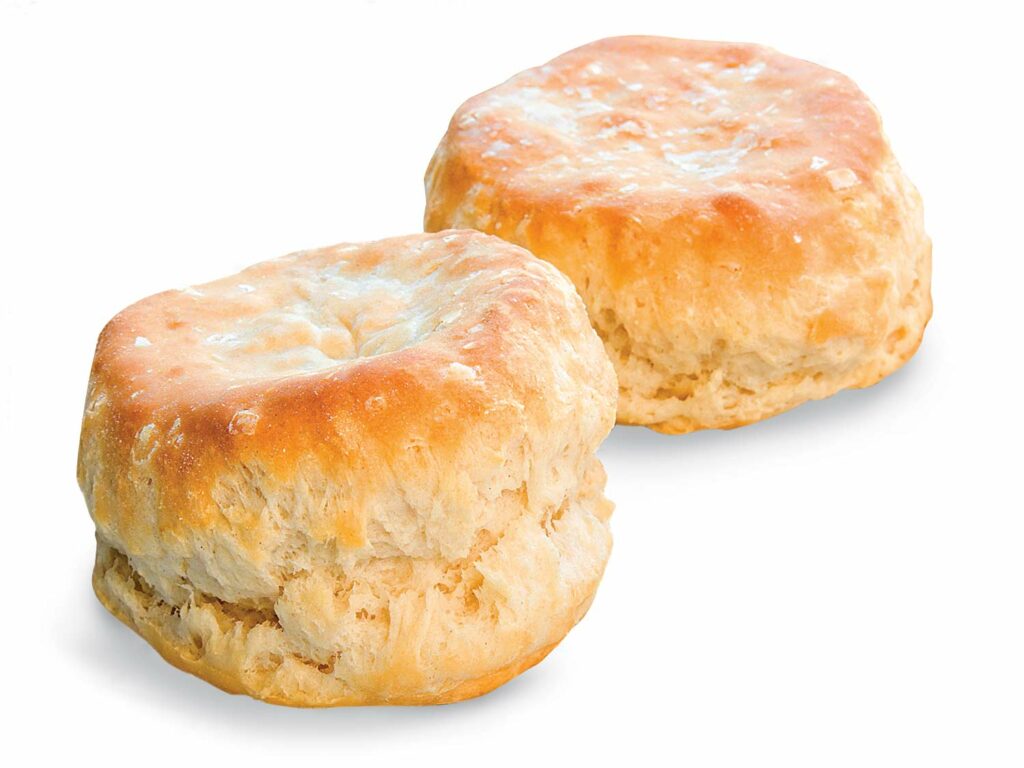 Two butter biscuits on a white background.