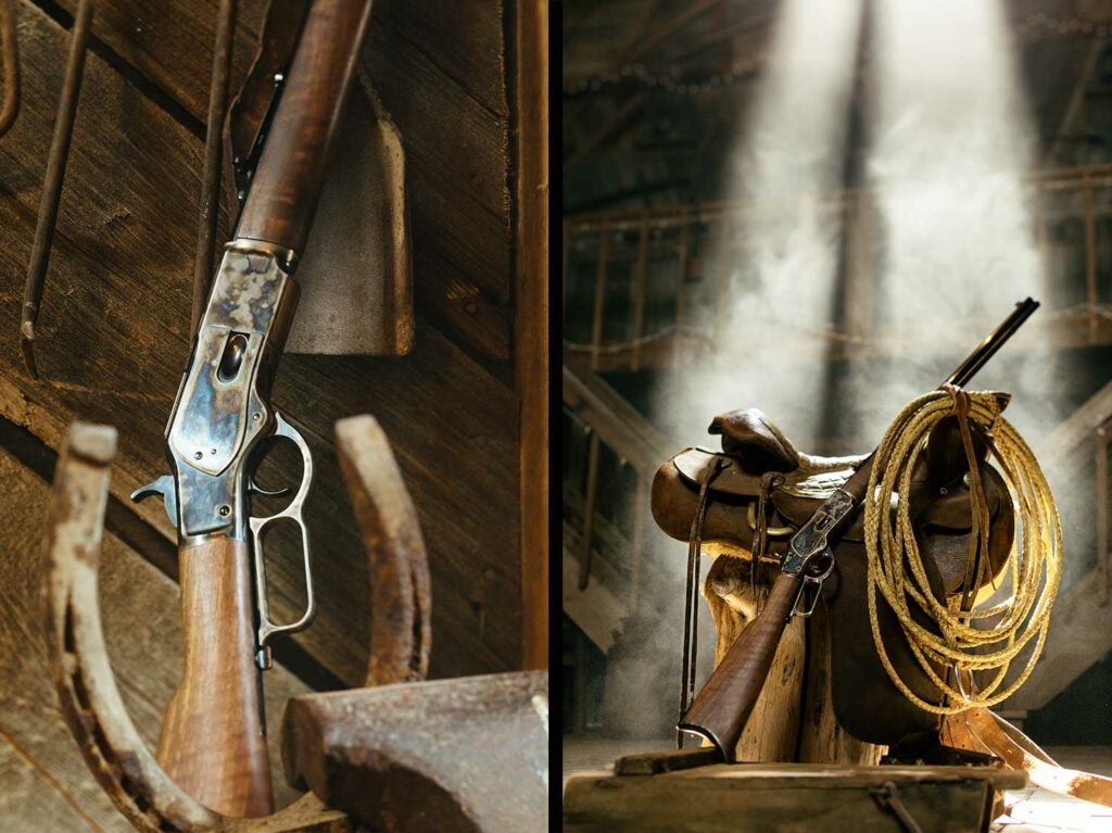 A Winchester rifle leaning against a leather saddle in a barn.