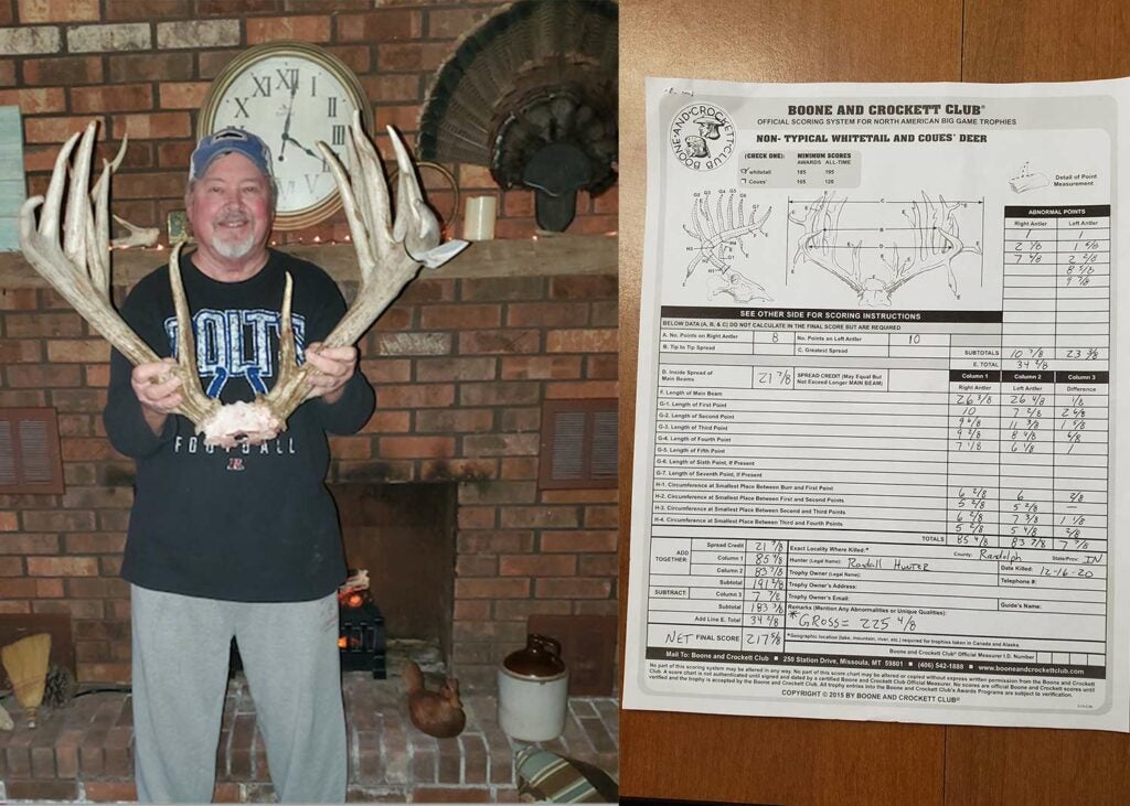 A hunter holds up deer antlers next to a antler score sheet.
