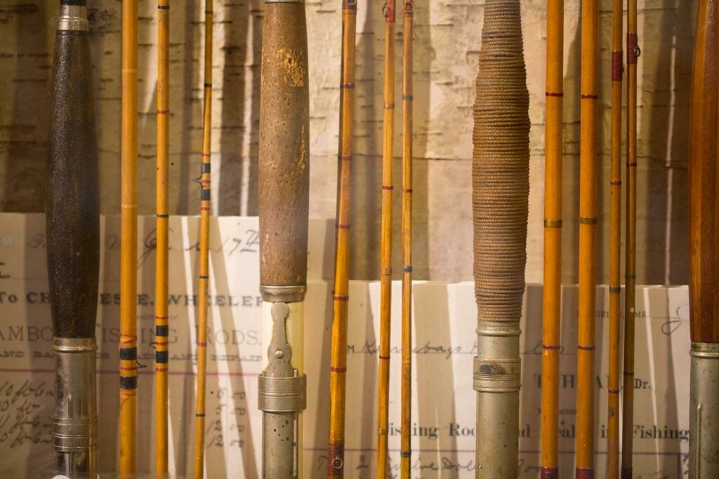a group of antique bamboo fly rods